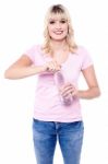 Young Girl Opening Bottle Of Clean Water Stock Photo