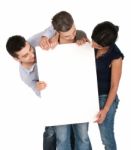 Brother And Sisters Looking At Banner Stock Photo