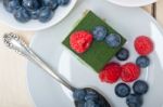 Green Tea Matcha Mousse Cake With Berries Stock Photo