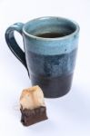 Used Tea Bag With Tea Cup Stock Photo