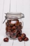 Glass Jar Full Of Chestnuts Stock Photo