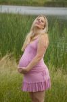 Pregnant Woman Relaxing By The Lake Stock Photo