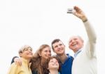 Smiling Family Taking Photos Stock Photo