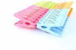 Row Of Peg Package Focus Near On White Background Stock Photo