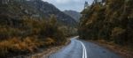 Road And Mountains In The Tasmanian Countryside Stock Photo