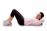 Side View Of Exercising Female On White Background Stock Photo