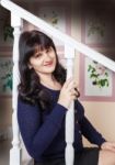 Young Beautiful Woman Sitting On The Stairs Stock Photo