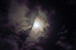 Full Moon Shining Glowing Light Through The Darkness Of Cloudy N Stock Photo