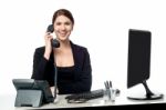 Female Secretary Answering Phone Call Stock Photo