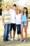 Portrait Of A Happy Family Of Four Stock Photo