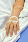 IV Solution In Patients Hand Stock Photo