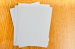 White Paper On Wood Table Stock Photo