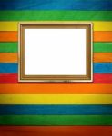 Gold Picture Frame On Colorful Wood Stock Photo