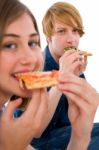 Teenage Couple Eating Pizza Stock Photo