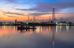 Oil Refinery At Twilight In Bangkok, Thailand Stock Photo