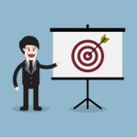 Target With Arrow And Businessman Presentation Stock Photo