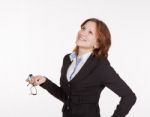 Pretty Business Woman Holding A Glasses And Looking Up Stock Photo