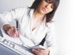 Business Lady Writing On Notebook Stock Photo