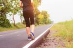 Girl Is Jogging On Street Stock Photo