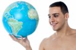 Young Man Holding Globe Map Stock Photo