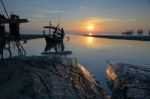 Silhouette Fisherman Is Standing On Fishing Boat Stock Photo