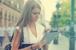 Business Woman With Tablet Computer Walking On Urban Street Stock Photo