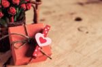 Heart-shaped And Gift On Wooden Stock Photo