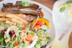 Delicious Barbecued Ribs And Lemon Soda Drink Stock Photo