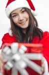 Santa Claus Hat With Red Christmas Gift Box Stock Photo