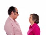 Aged Couple Looking Each Other Stock Photo