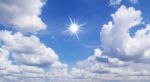 Blue Sky With White Clouds And Sun Stock Photo