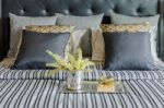 Tray Of Book With Vase Of  Plant On Bed In Luxury Bedroom Stock Photo