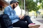 Modern Young Man With Mobile Phone In The Street Stock Photo