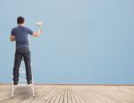 Man Painting  Wall Stock Photo