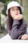 Thai Adult Girl White Cap Gray T-shirt Beautiful Girl Relax And Smile Stock Photo