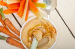 Fresh Hummus Dip With Raw Carrot And Celery Stock Photo