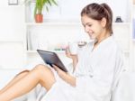 Woman In Bathrobe Relaxing At Home Stock Photo