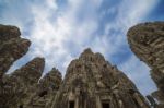 Ancient Stone Faces Of King Jayavarman Vii At The Bayon Temple, Stock Photo