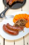 Beef Sausages Cooked On Iron Skillet Stock Photo