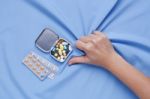 Pain From Illness Closeup Hand With Pills Stock Photo