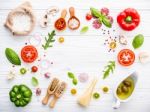 The Ingredients For Homemade Pizza On White Wooden Background Stock Photo