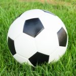 Soccer Ball On Green Grass Stock Photo