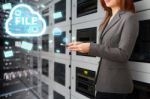 Programmer In Data Center Room Stock Photo