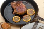 Pork Chop Seared On Iron Skillet Stock Photo