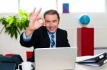 Cheerful Handsome Manager Gesturing Perfect Sign Stock Photo