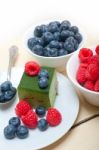 Green Tea Matcha Mousse Cake With Berries Stock Photo