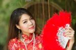 Beautiful Asian Girl With Chinese Traditional Dress Cheongsam Stock Photo