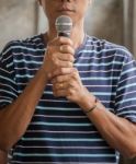 Portrait Of Young Asian Man And Microphone In Hand Stock Photo