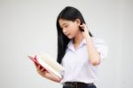 Asia Thai High School Student Uniform Beautiful Girl Read A Book Stock Photo