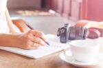 Woman Hand With Pen Writing On Notebook Stock Photo